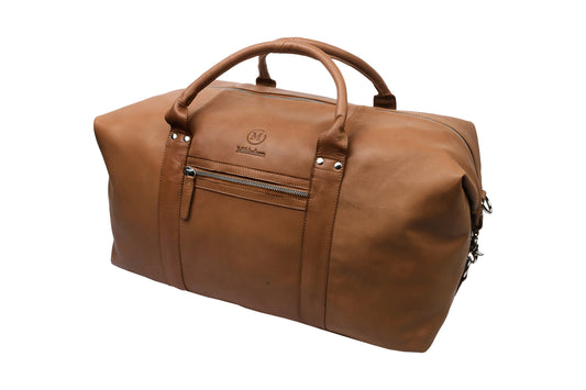 Cognac leather travel bag front view showing YKK brass zipper and front pocket.