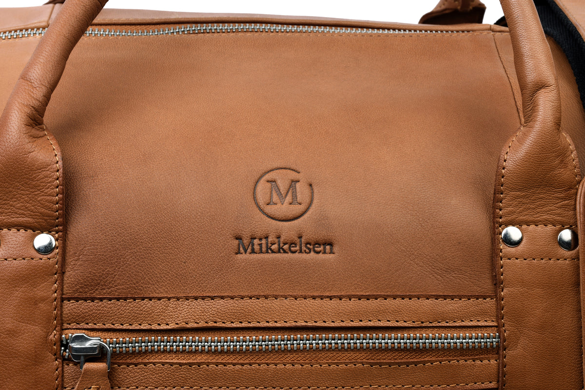 Close-up of cognac vegetable-tanned full-grain leather grain and natural patina.