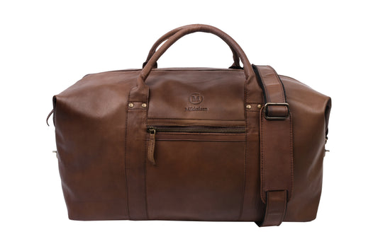 Mikkelsen Copenhagen Dark Brown Travel Bag, full-grain vegetable-tanned leather weekender. With adjustable leather shoulder strap.