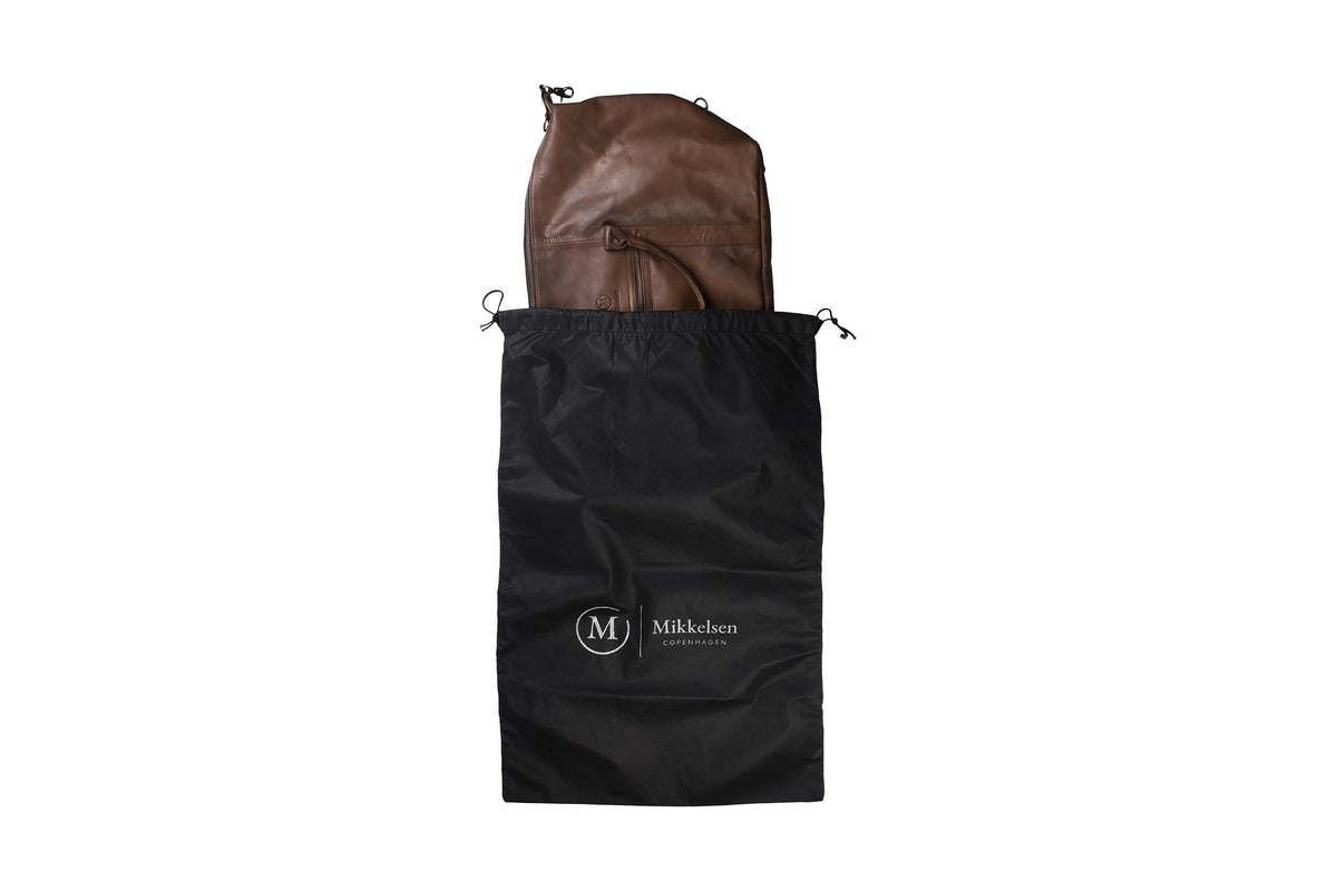 Mikkelsen Copenhagen dark brown travel bag with dust bag included.